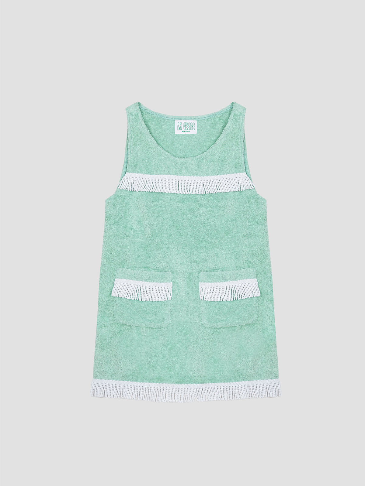 Colour: Green Pool/White.   Short towel dress made in green pool cotton, with white fringed details.   Regular fit. Short length. Two front pockets with white fringes.  Crew neck. White fringe detail on the chest and at the bottom.