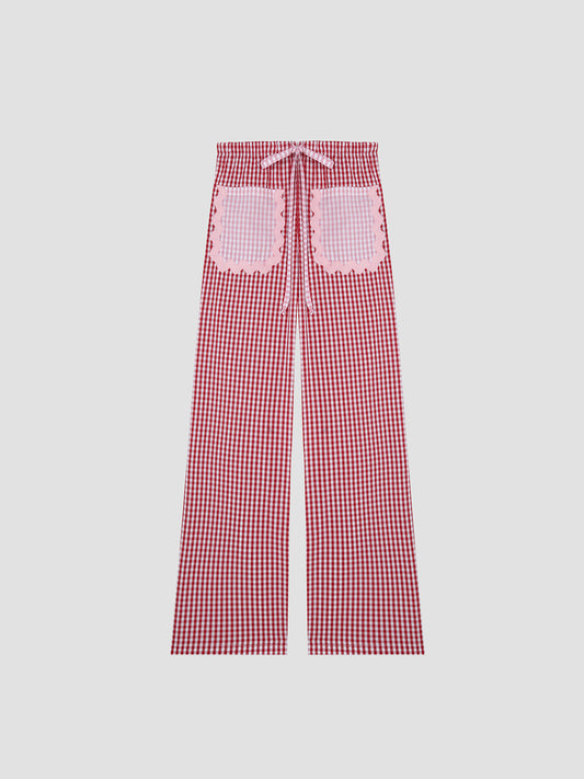 Red vichy adjustable trousers with two pink front pockets and trim details.