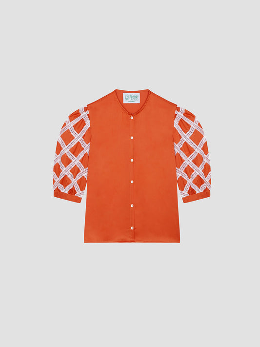 Alfresco Shirt Satin Orange is a shirt with puffed sleeves in orange satin and lace details.
