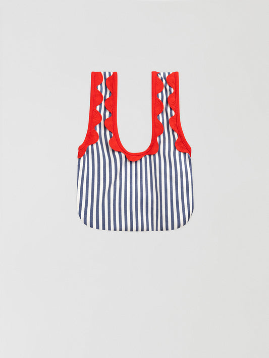 Anchor Blue Mini Handbag is a mini blue striped handbag with matching red ripple detail.