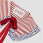 Red and white striped cotton collar with blue and white flounces and matching red bow