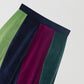 Flared midi skirt in velvet with asymmetric pattern in light green, aubergine and navy. 