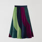 Flared midi skirt in velvet with asymmetric pattern in light green, aubergine and navy. 