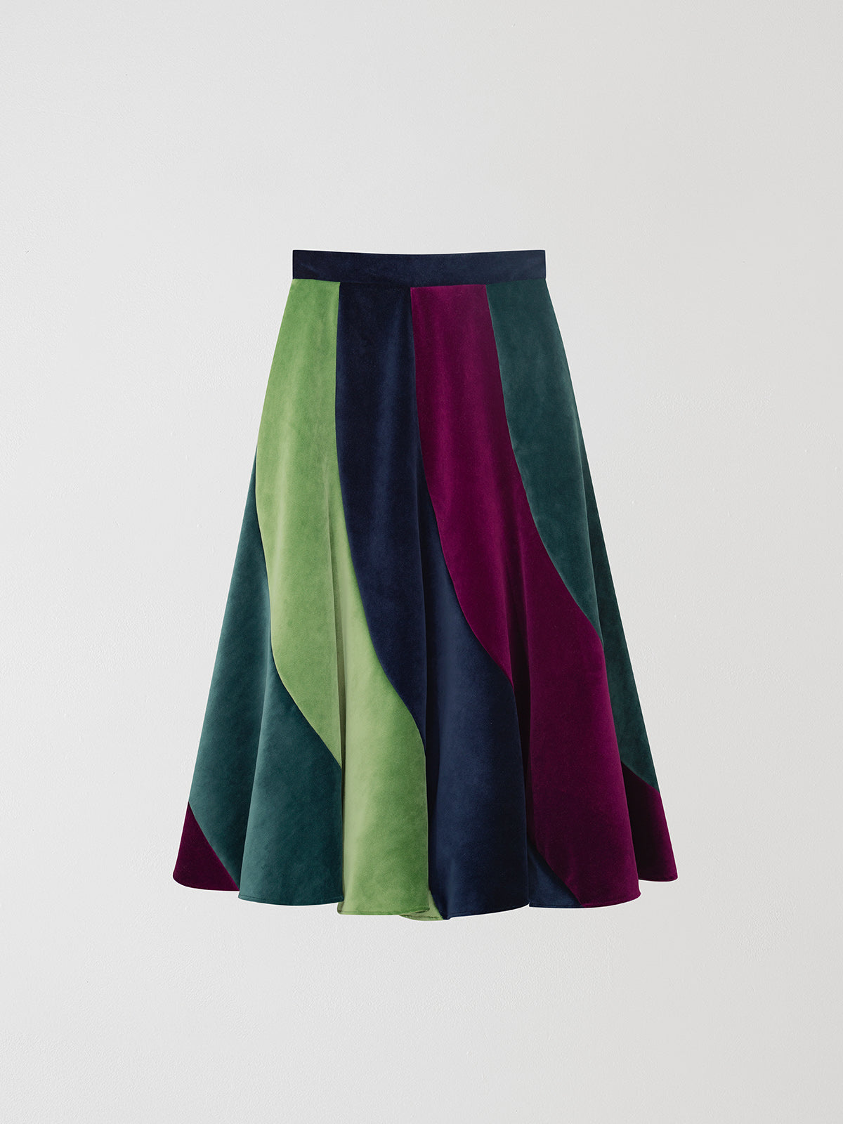 Flared midi skirt in velvet with asymmetric pattern in light green, aubergine and navy.