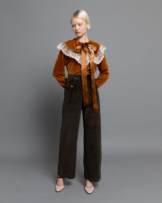 Dark green high waisted corduroy trousers.