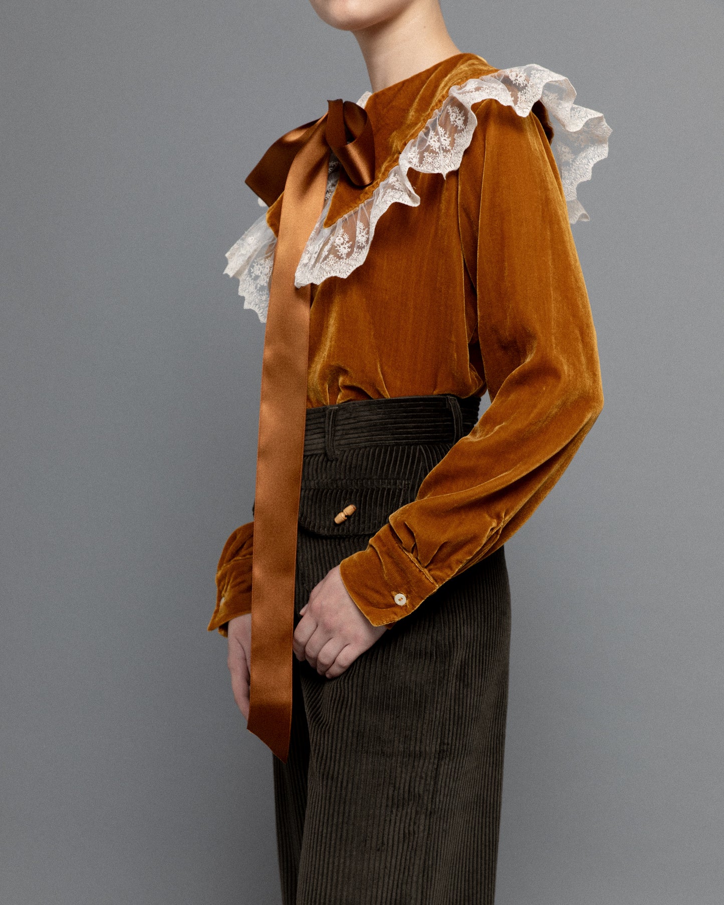 Dark green high waisted corduroy trousers.