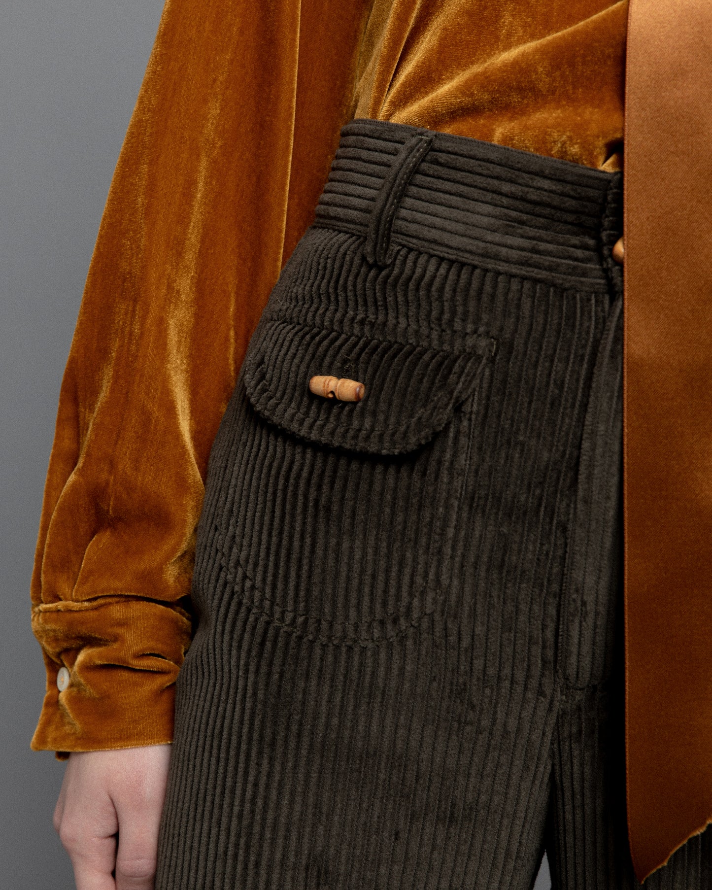 Dark green high waisted corduroy trousers.