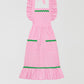 Cocinitas Apron Pink is a pink vichy cotton apron with front pockets and matching green piping details.