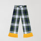 Checked trousers in green, yellow and navy with yellow fringes. 