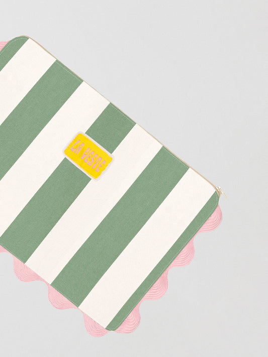Green and white striped toiletry bag with top zipper and pink piping details 