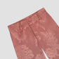 Pale pink high-waist pants with floral print