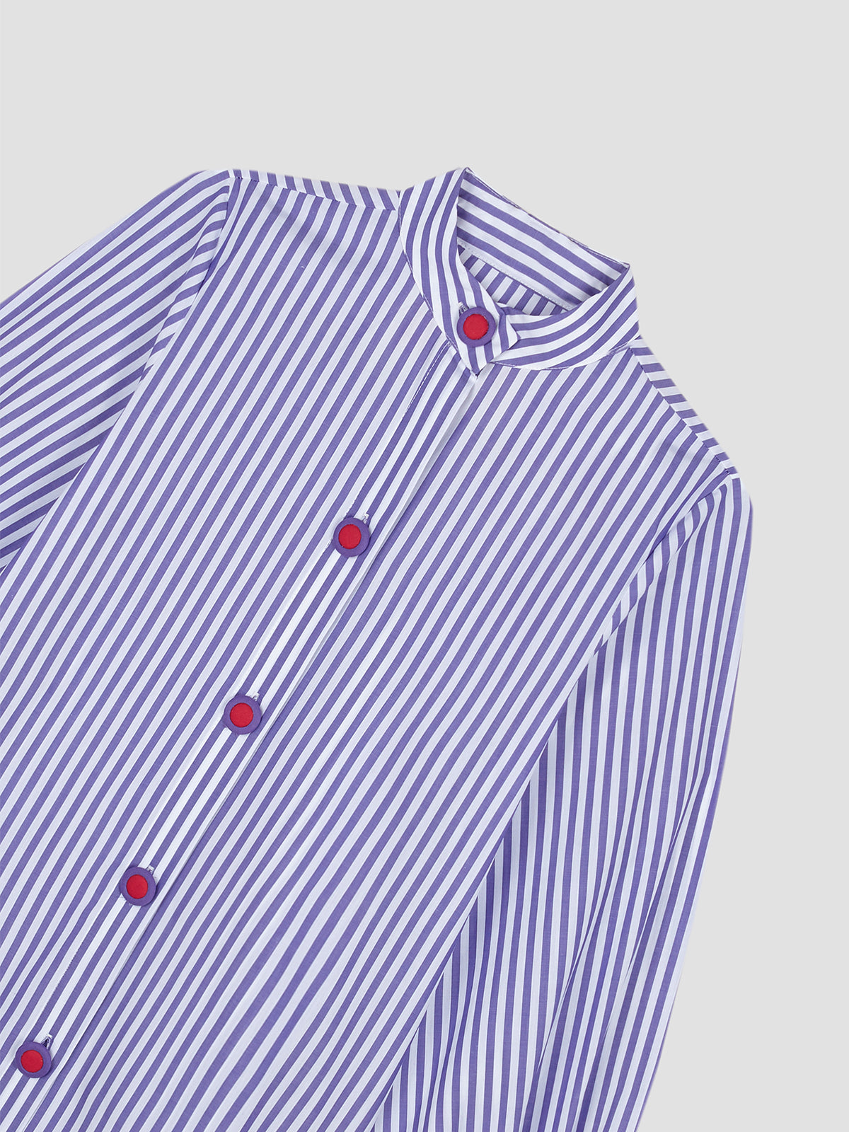 Women's long sleeve shirt with purple stripes and matching purple and red button closure.