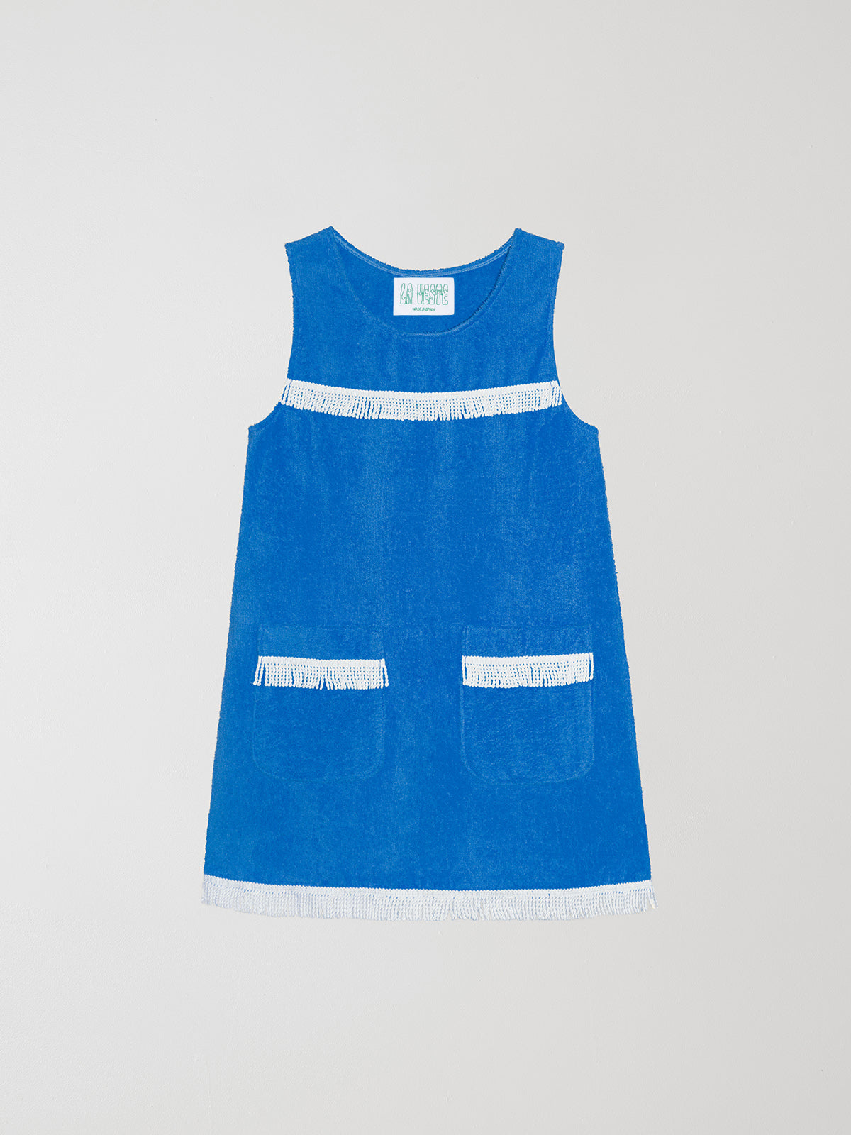 Fringes Mini Towel Blue is a short blue dress with white fringe details on the chest and at the end of the skirt.