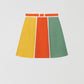 Flared linen mini skirt with asymmetric print in orange, yellow and green.