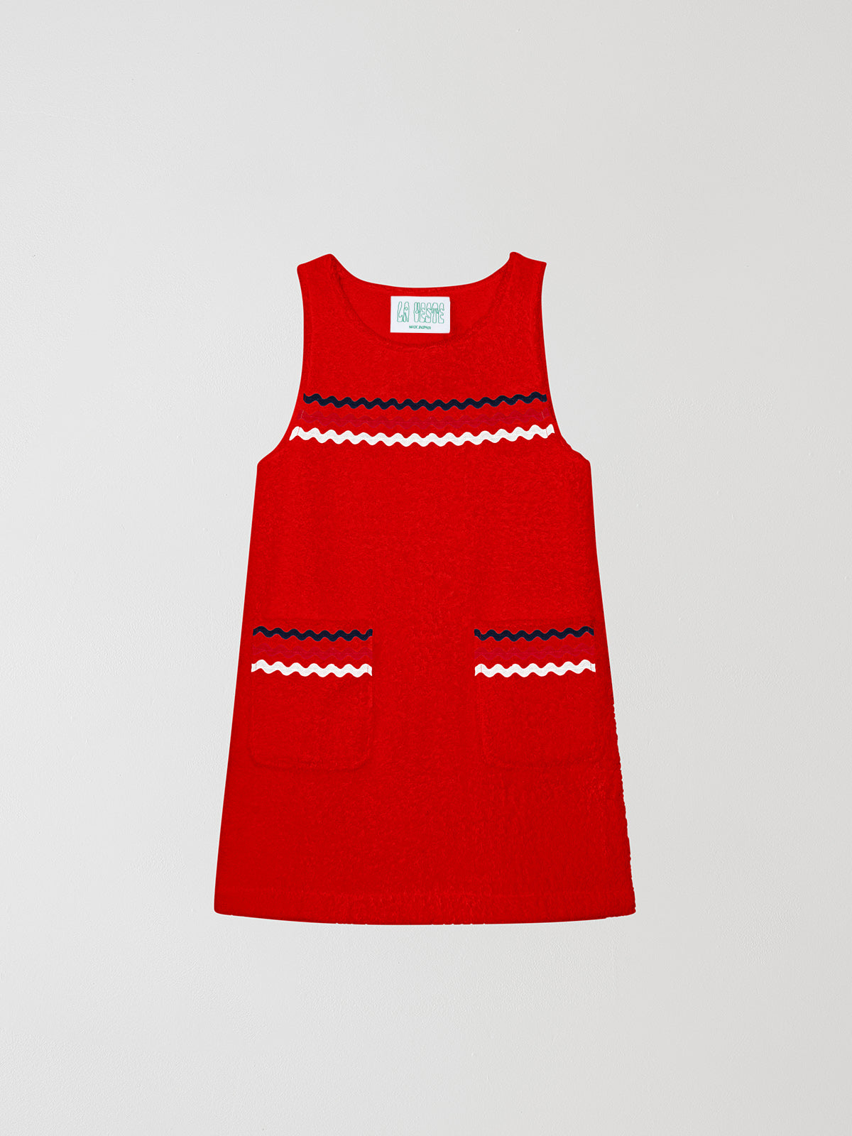 Mini Towel Red is a short sleeveless dress with blue, white and pink trim on the chest area and pockets.