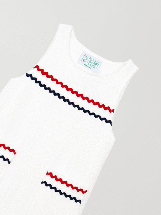 Short white dress with front pockets and red and navy blue piping details