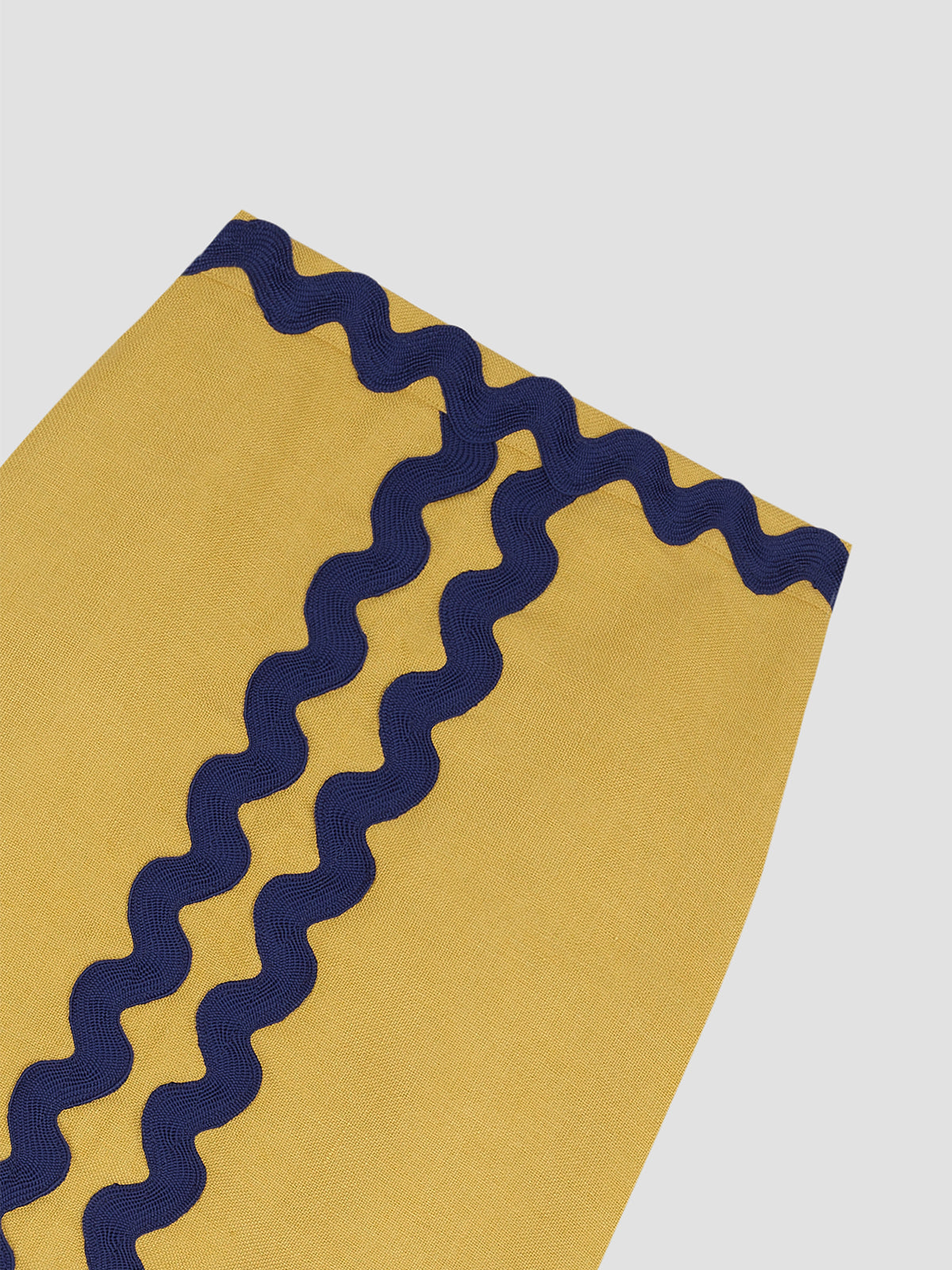 Midi skirt made in yellow linen with navy trim detail