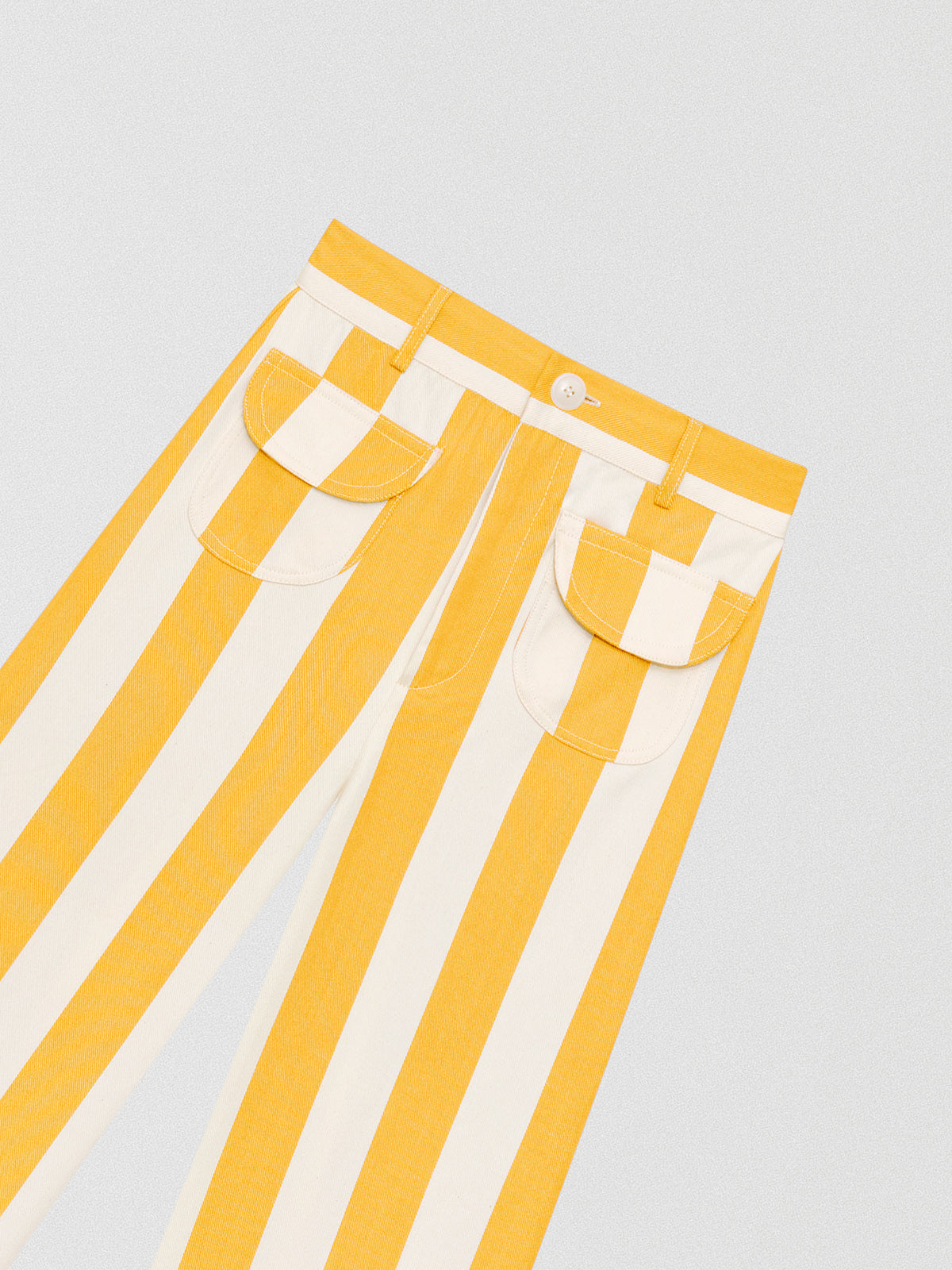 Yellow high-waisted trousers printed in cotton with yellow and ecru stripes.