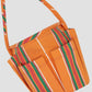 Round base bag in our iconic orange Pippi fabric. It features a medium short handle and external pockets. 