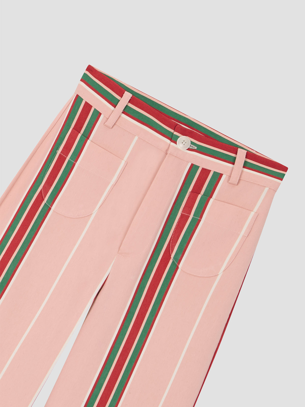 Pink high-waisted printed trousers in cotton with red and green stripes.