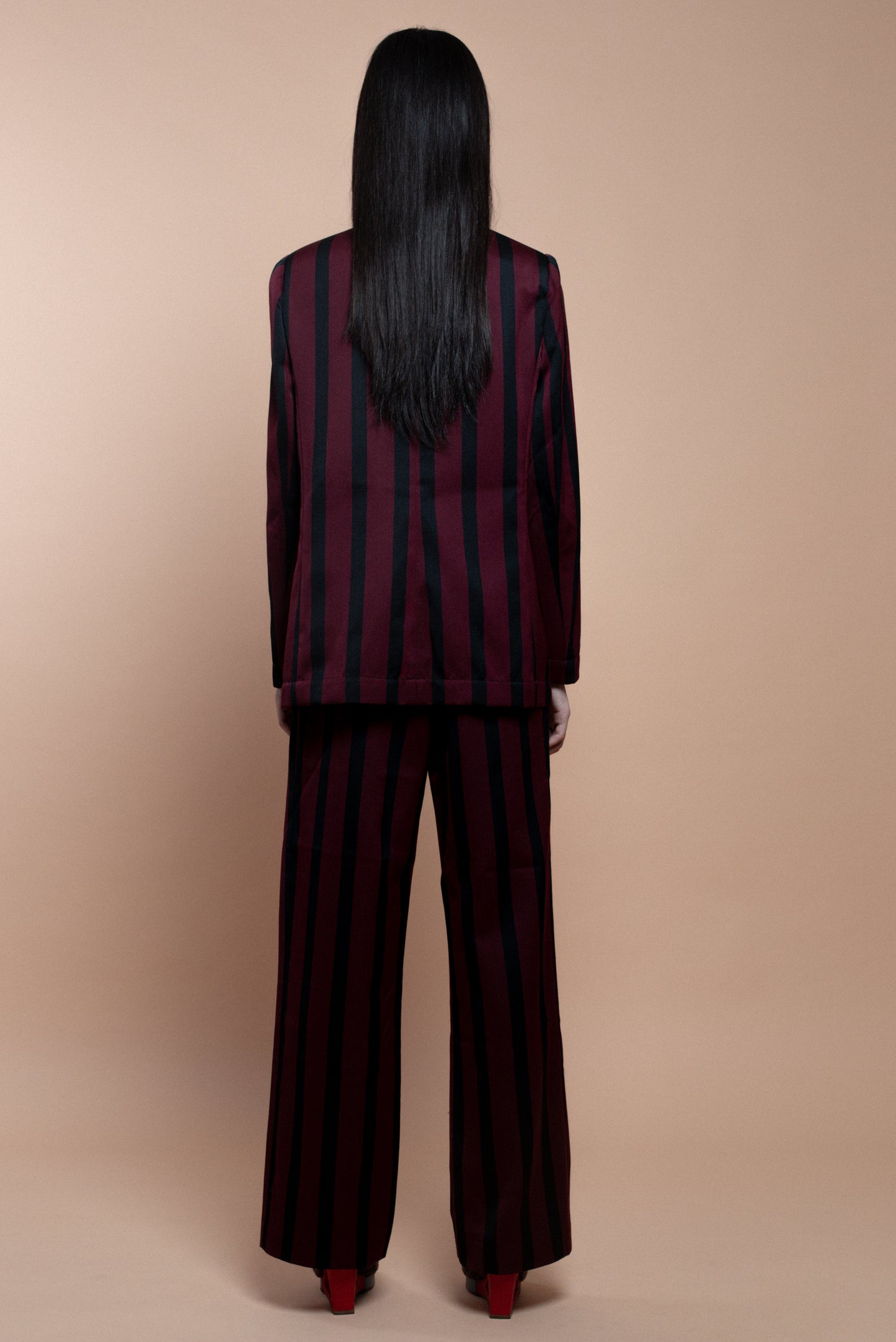 Burgundy and black striped suit trousers.