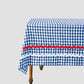 Rectangular tablecloth made of&nbsp;blue and white vichy check cotton with&nbsp;red and&nbsp;white&nbsp;trim