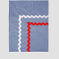 Tablecloth Mini Check Blue is a quilted tablecloth with blue and white piping details on the edge.