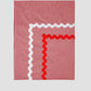 Tablecloth Mini Check Red is a rectangular red vichy check tablecloth with red and white piping details.