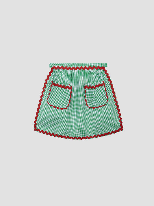 Tatin Apron Green is a green vichy quilted apron with red piping detail and front pockets.