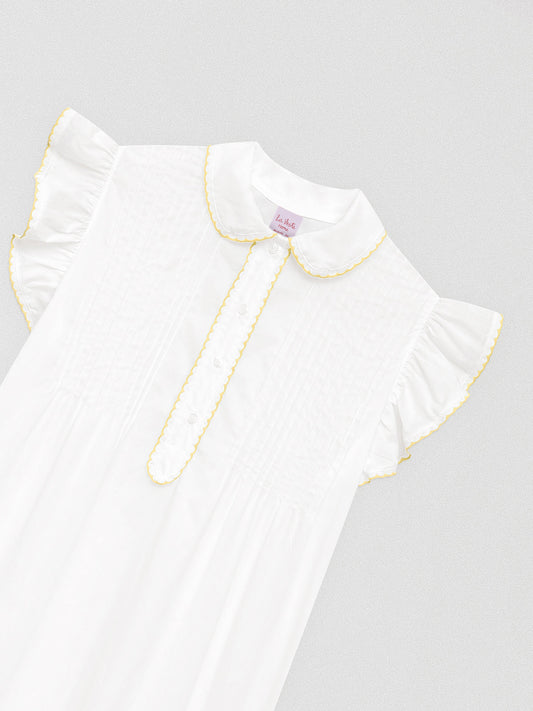 White mido camisole with baby collar and contrasting yellow bias binding details