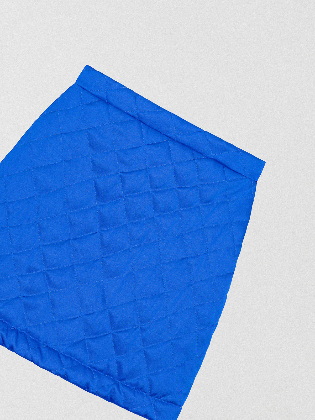 Quilted mini skirt made in blue. 