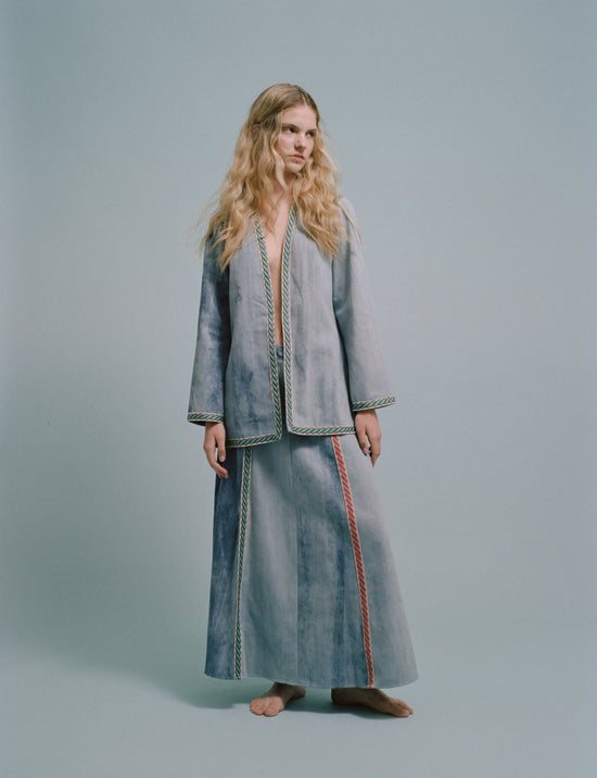 Woman in denim jacket and long skirt