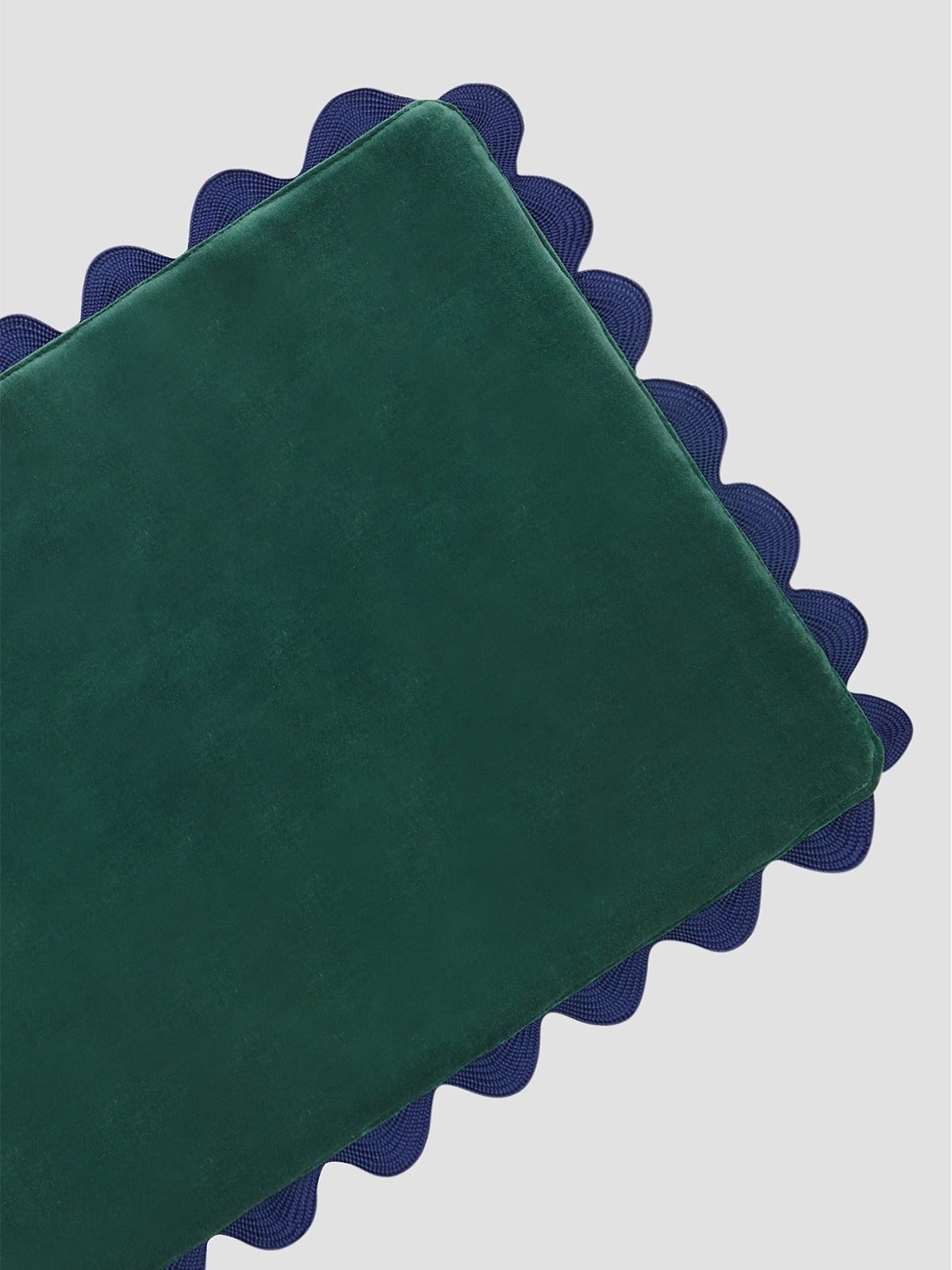 Green velvet tablecloth with blue piped borders 