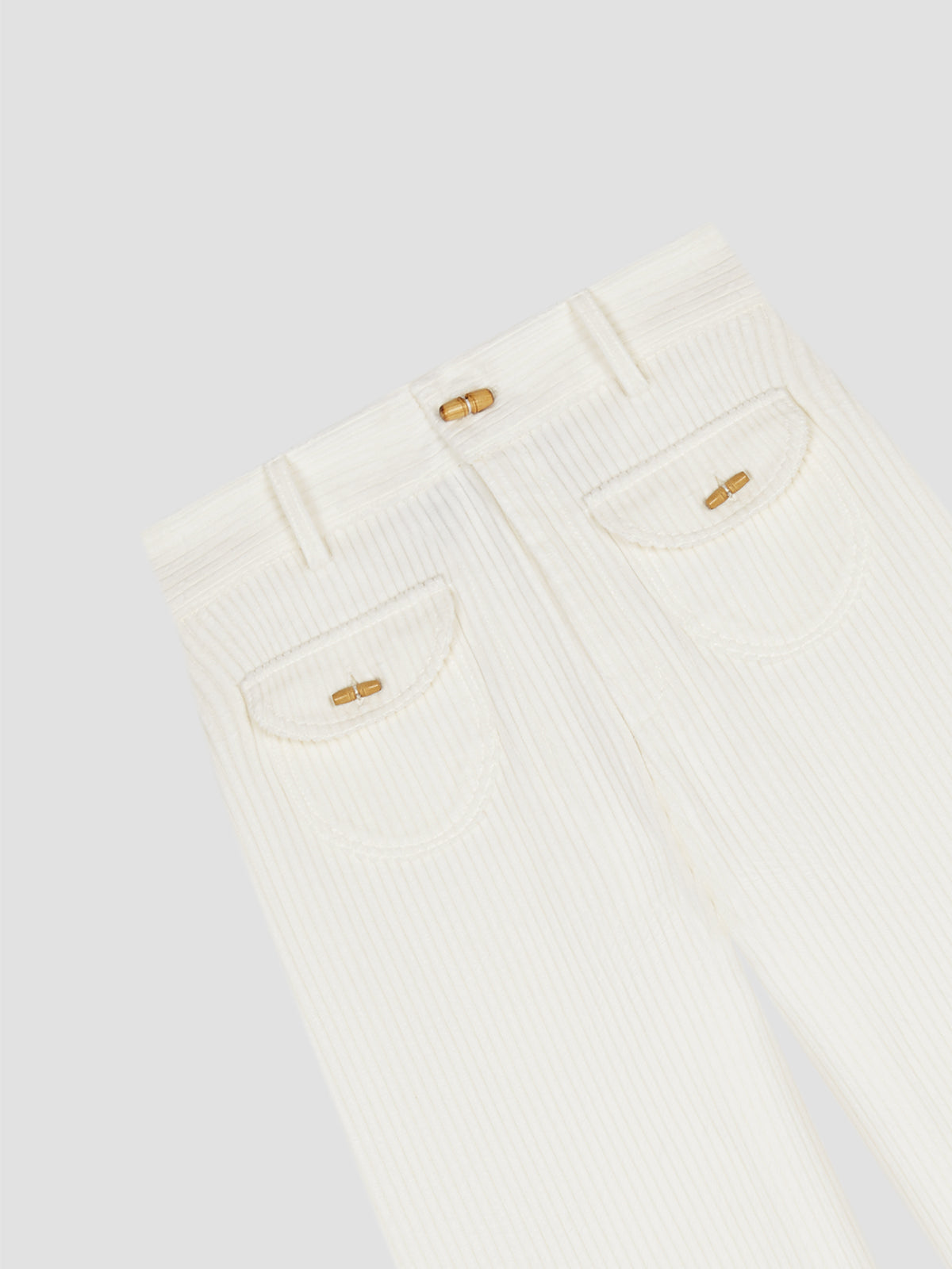 corduroy trousers in white with wooden buttons