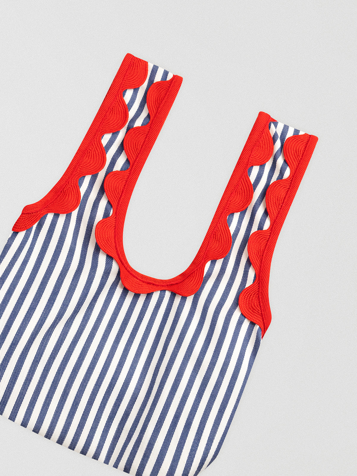 Blue and white striped mini bag with red undulina detail on handles