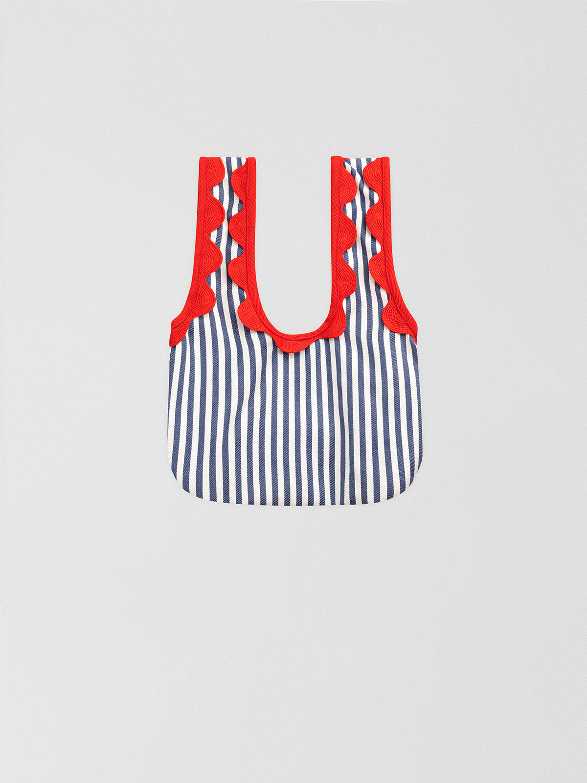 Anchor Blue Mini Handbag is a mini blue striped handbag with matching red ripple detail.