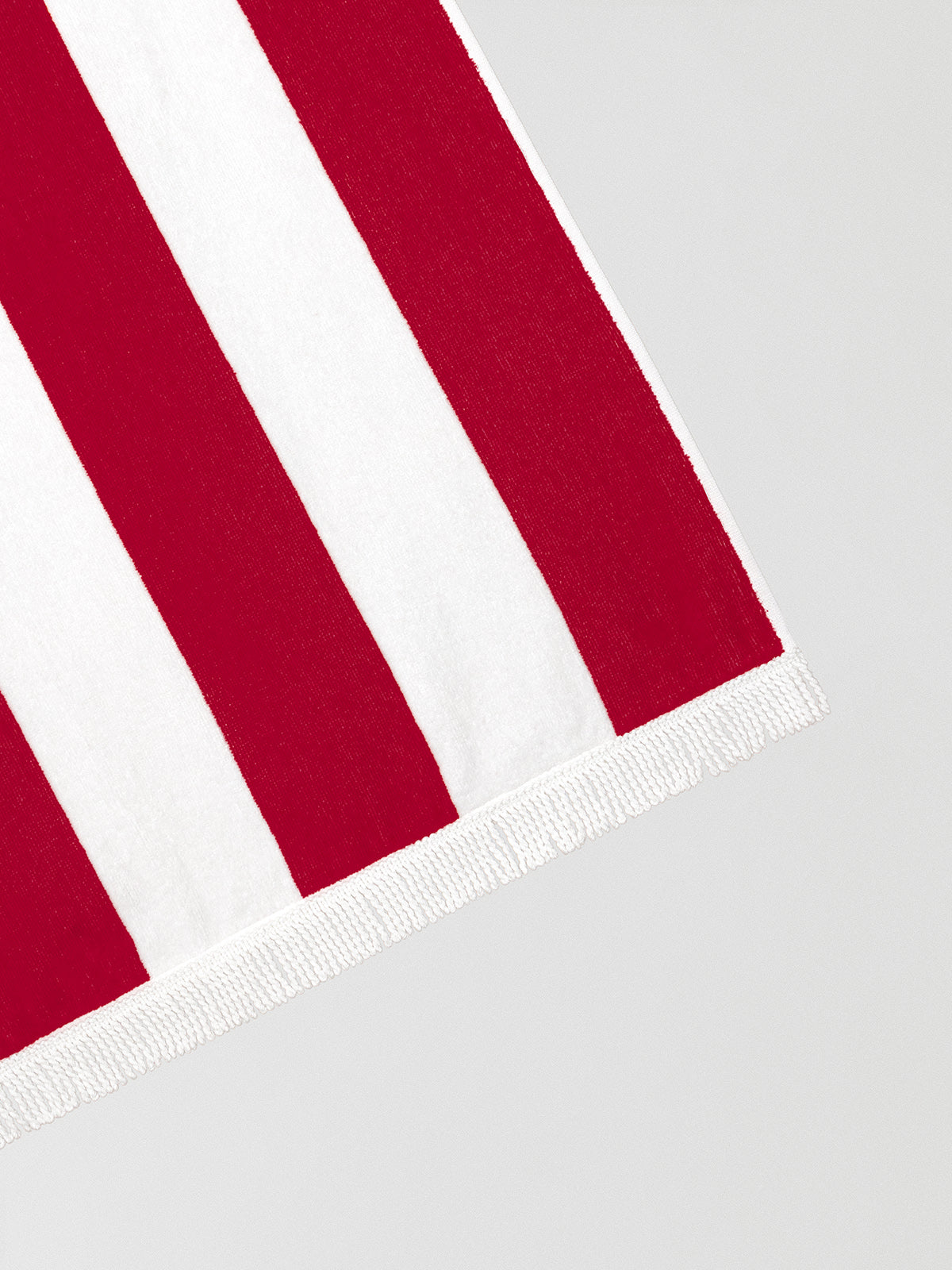 Red and white striped towel made of cotton