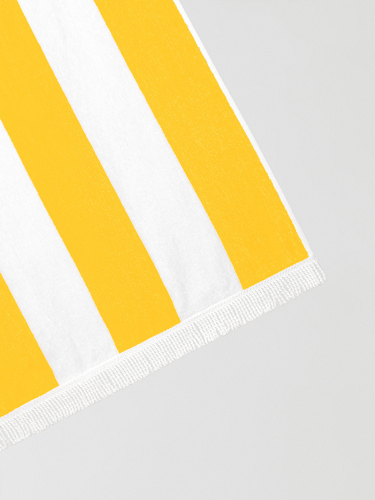 Yellow and white striped towel made of cotton. 