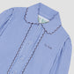 Long sleeve blue striped shirt with buttons lined with the same design as the shirt.