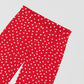 Red trousers printed with white polka dots and blue bottom.