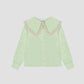 Carol Shirt Satin Green is a long sleeve green satin shirt with XL collar and lace details on the edges.