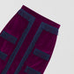 Aubergine velvet pencil skirt with navy fringed design on the front, bottom and top. 