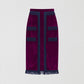 Aubergine velvet pencil skirt with navy fringed design on the front, bottom and top. 