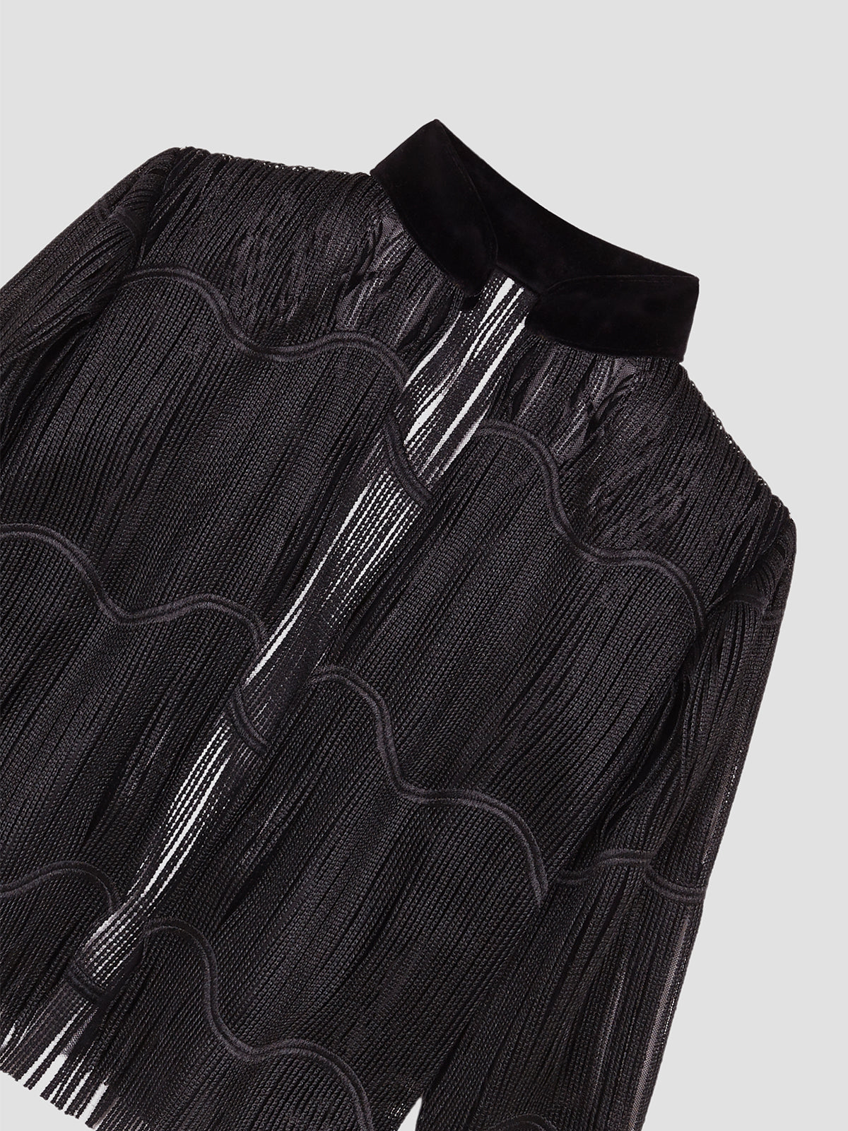 Black jacket made of black fringed strips