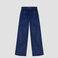 Clovis Pants Blue is a high-waisted dark blue trouser with wooden buttons on the front pockets.