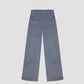 Clovis Pants Celeste is a high-waist corduroy pant with front pockets and wooden buttons.