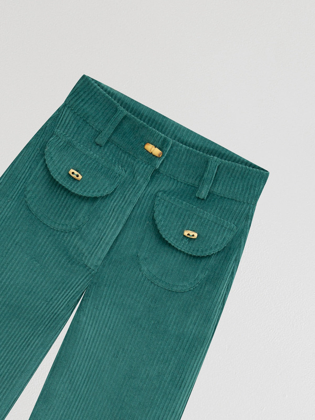 Turquoise high waisted corduroy trousers. 