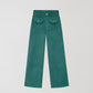 Turquoise high waisted corduroy trousers. 