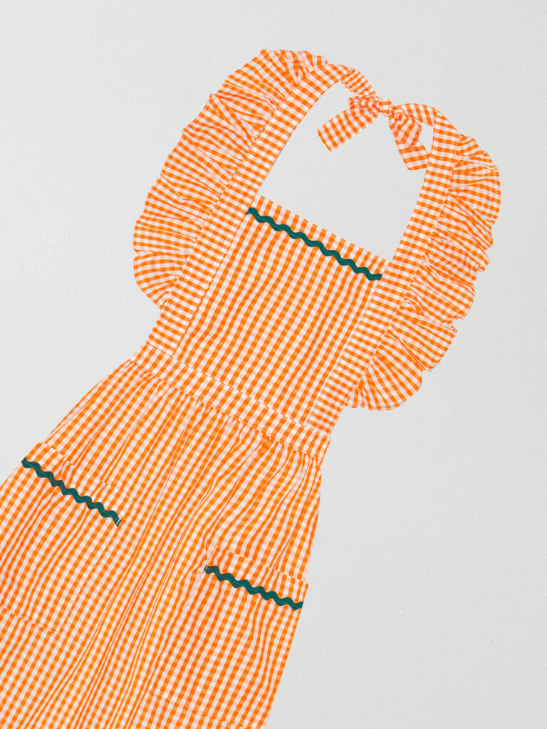 Orange and white long apron with matching green onduline details