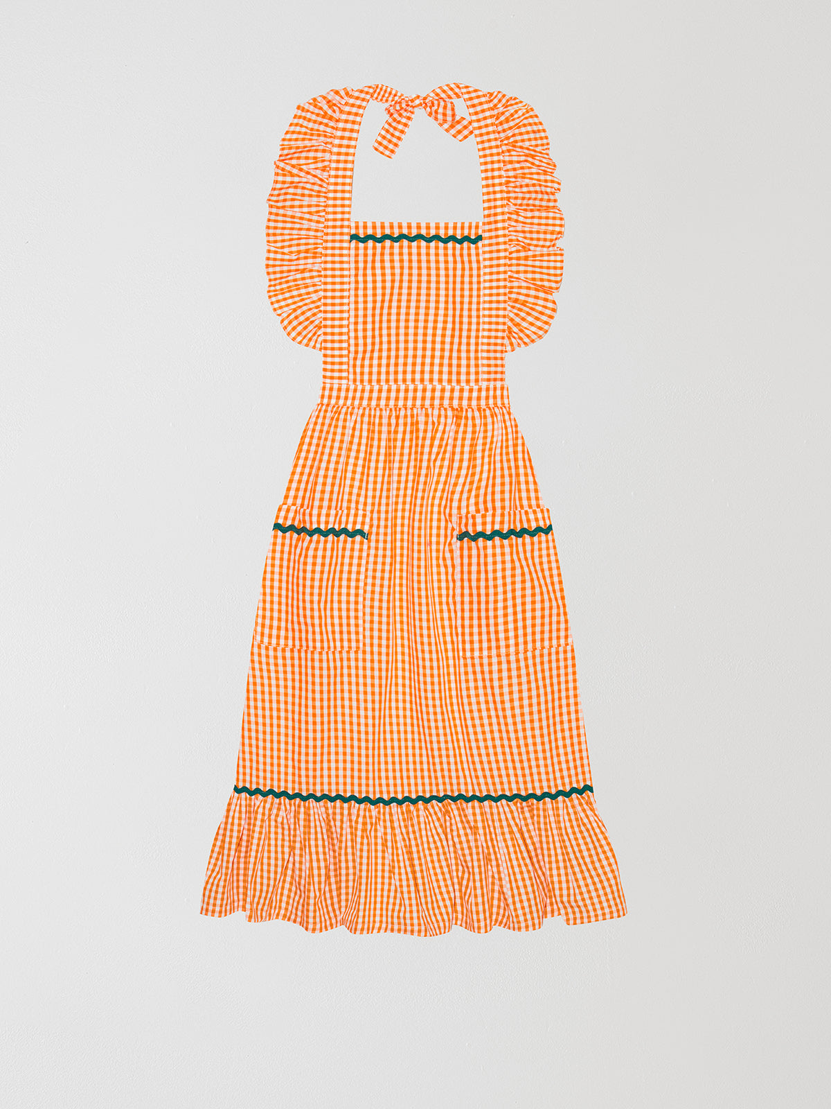 Cocinitas Apron Orange is an orange apron with ruffled straps and matching green onduline.